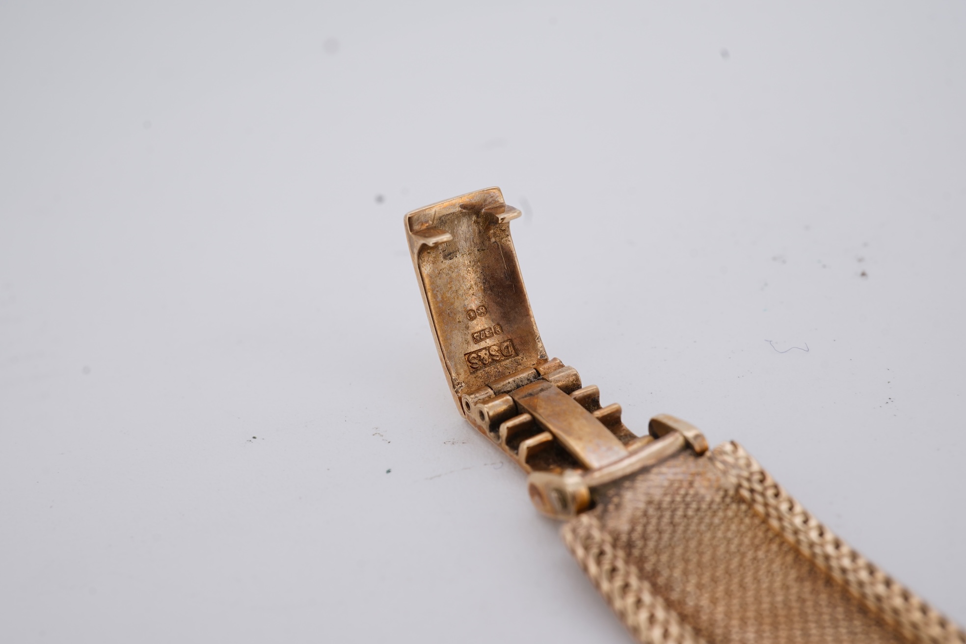 A lady's 1960's 9ct gold Rolex Precision manual wind wrist watch, with square dial, on an integral 9ct gold bracelet, the clasp with Rolex crown, overall length 15cm, gross weight 22 grams (bracelet a.f.)